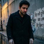 A lone figure under dim light, reflecting loneliness and betrayal.