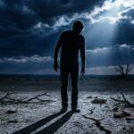 A lone silhouette under a dark sky, symbolizing betrayal and selfish people.